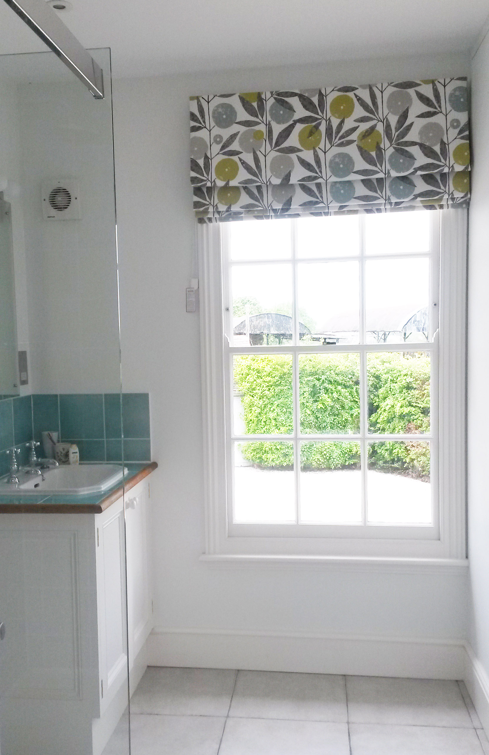 Scion fabric roman blind on rotary header rail - Dumbleton