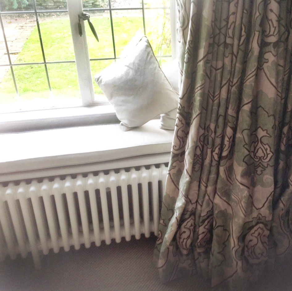 Mock wave interlined curtains in paradiso portinari by nina campbell with window seat cushions - Lower Slaughter