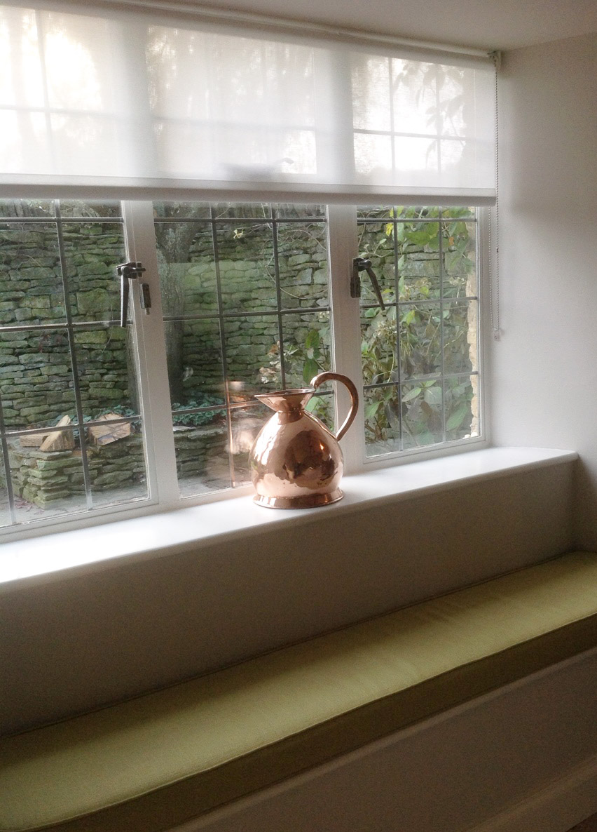 kitchen window seat cushion and Luxaflex sheer roller blind