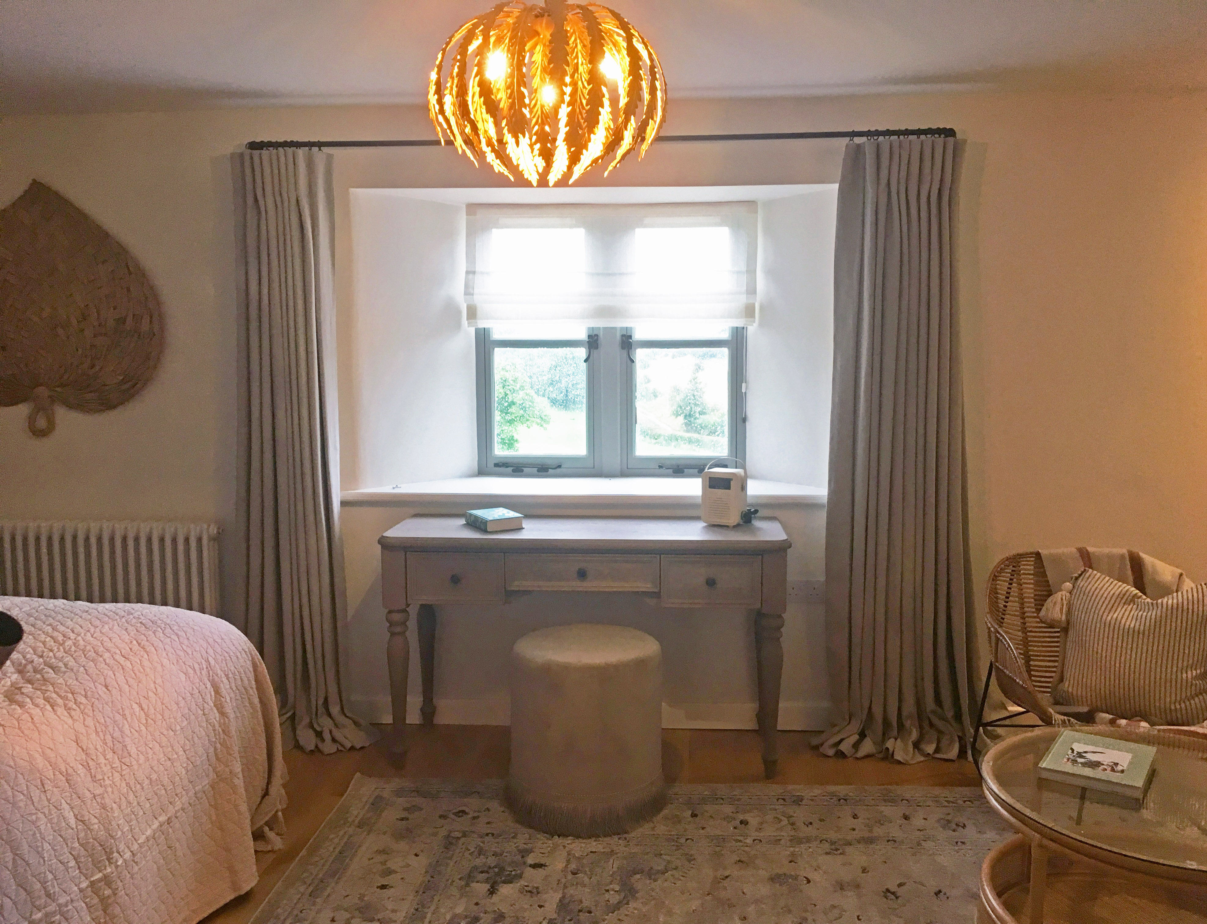 Inverted pleat linen curtains on 19mm diameter black French pole, with sheer linen roman blind. Cotswold Barn conversion near Cheltenham.