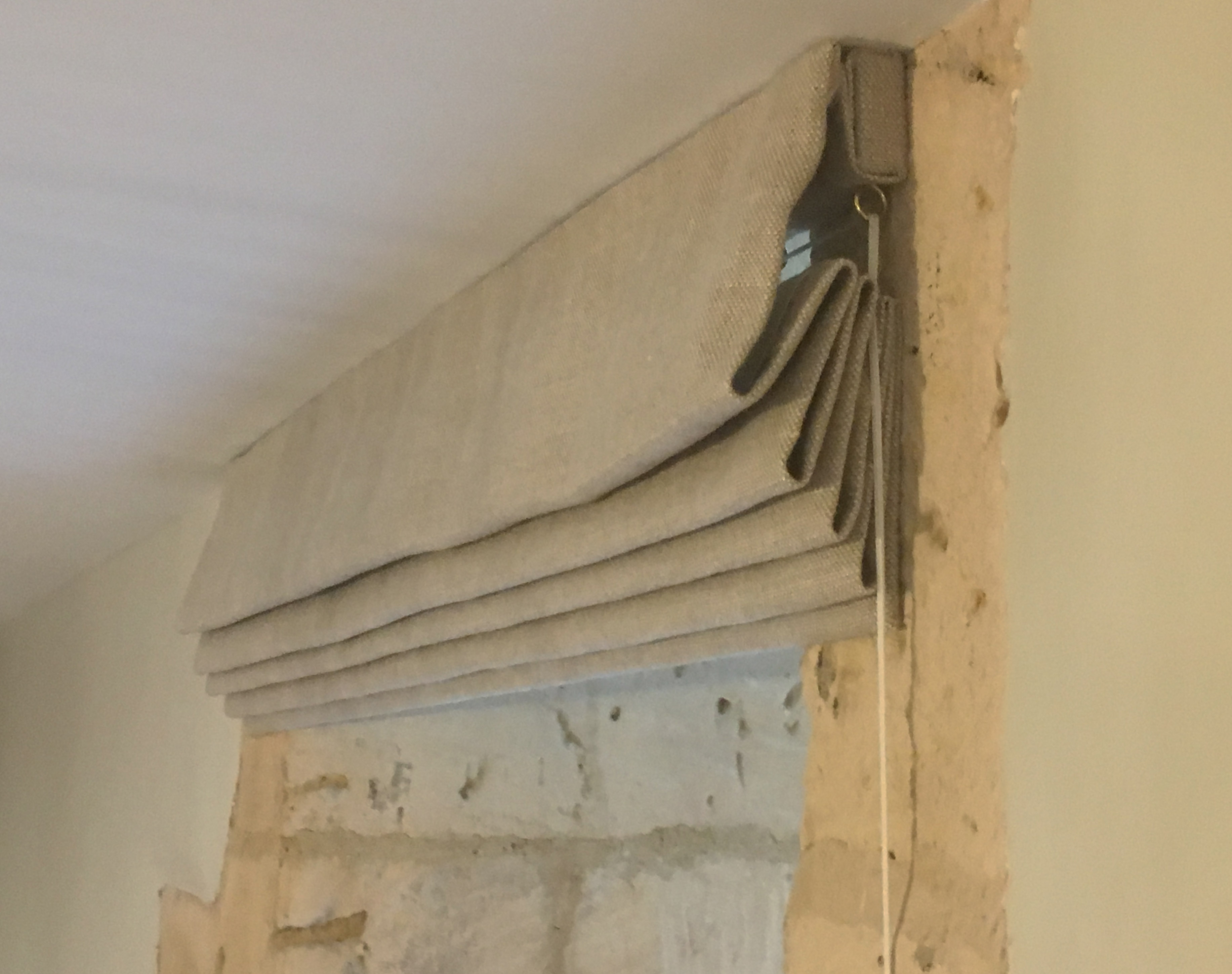 Slubby linen roman blind in Cotswold Barn conversion