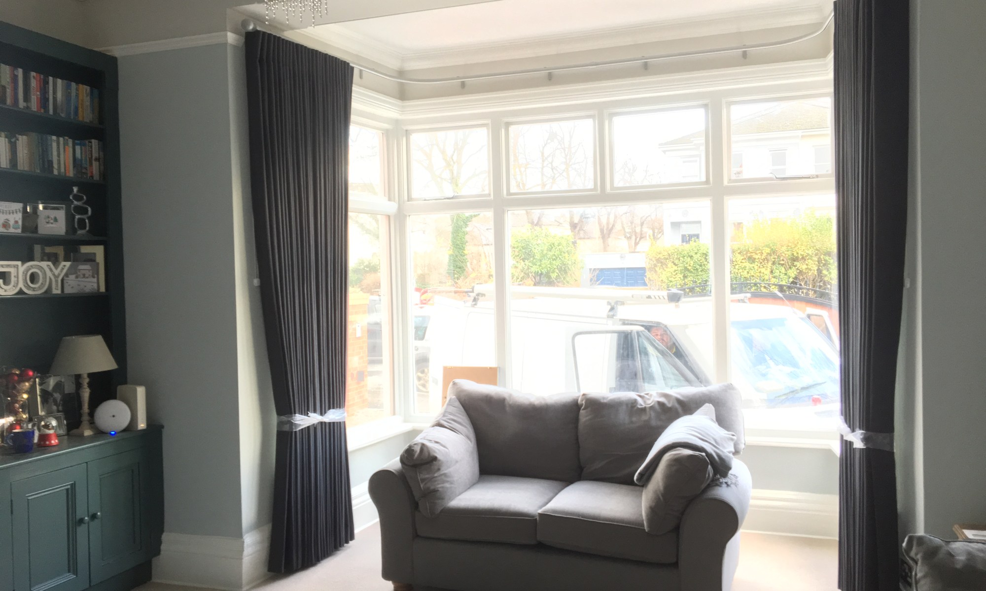 Cartridge pleat curtains on Silent Gliss Metropole in bay window - Cheltenham Town House